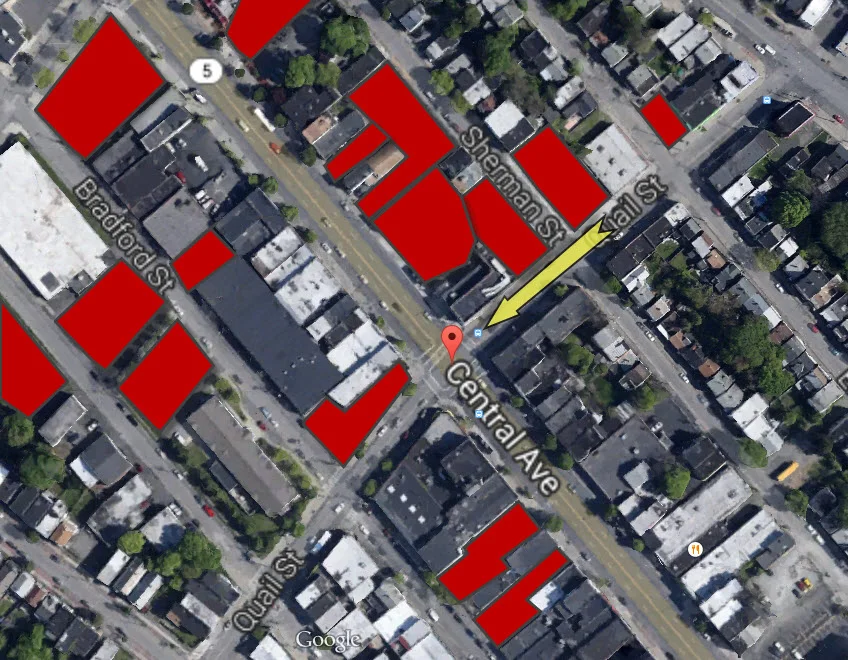 Red is available off-street parking. The yellow arrow identifies the travel direction of the garbage truck.