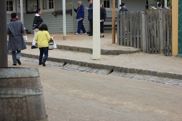 Many of the buildings had drains that ran out into the street. It looks very similar to a modern curb.