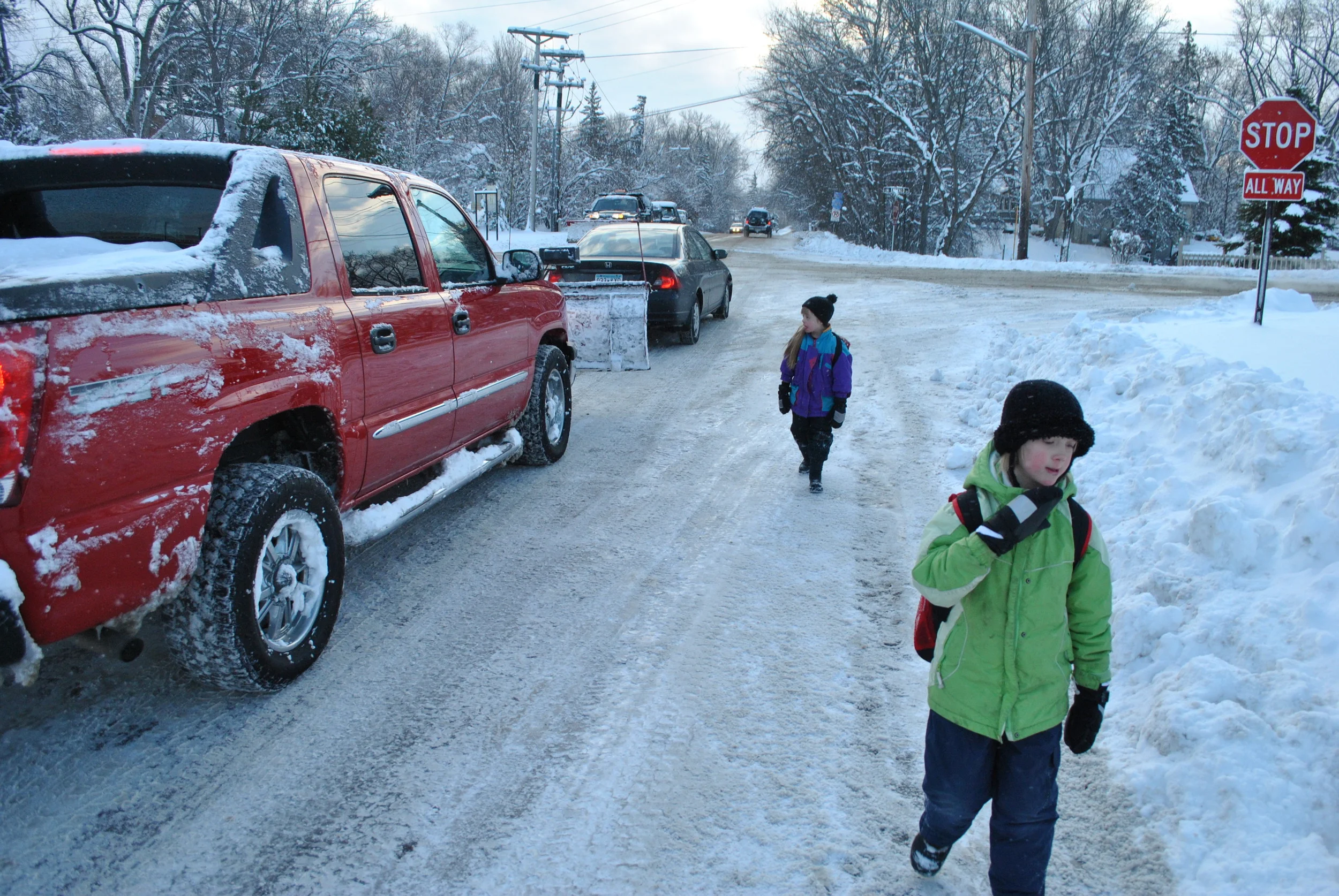George's daughters walking to school on a snowy day