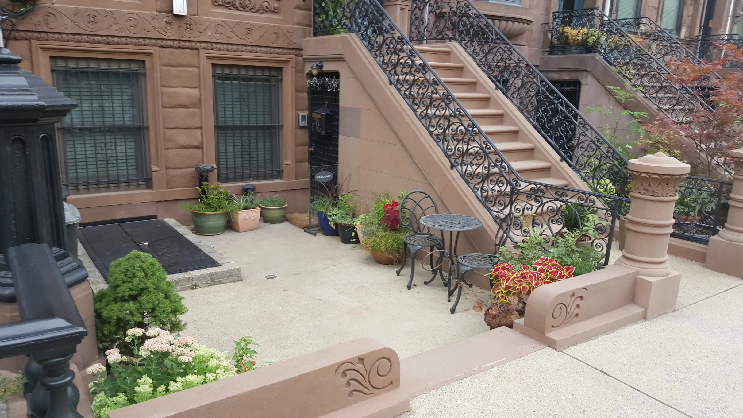 A pleasing front courtyard of a multi-family dwelling. Modern regulations would probably encourage the developer to make this a driveway to a garage instead.
