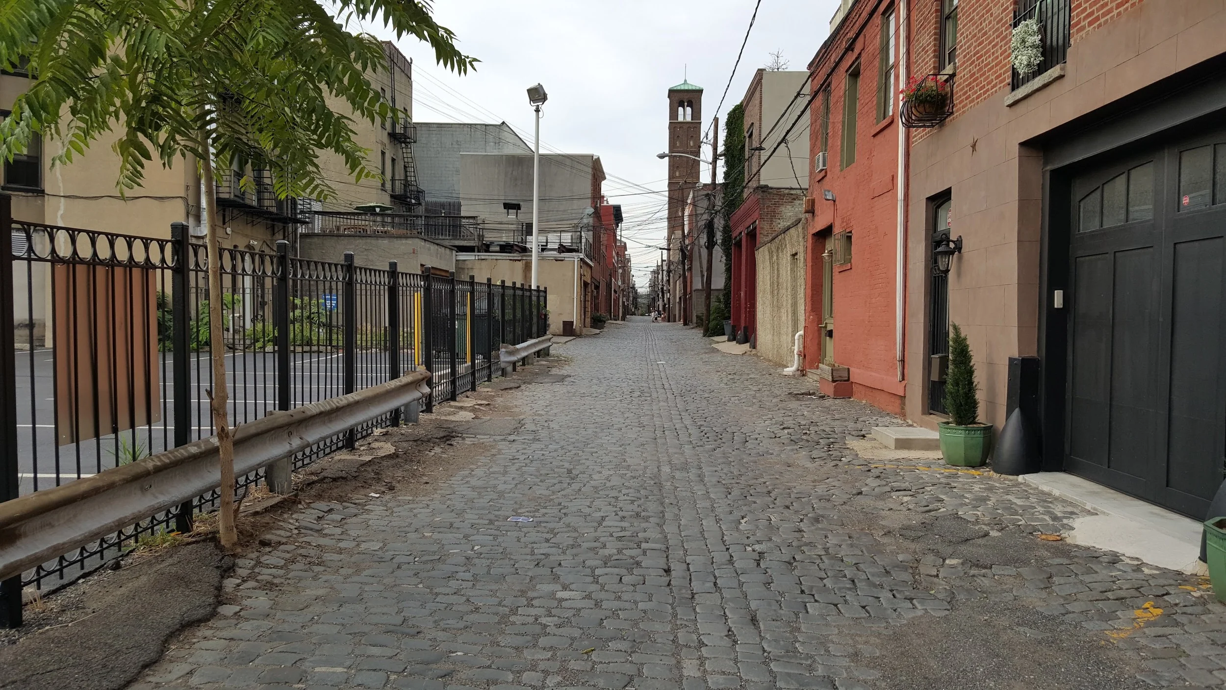 A parking lot along an alley in Hoboken, NJ. A waste of space, but relatively unobtrusive in moderation.