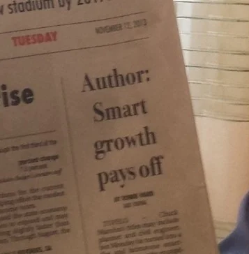 Newspaper headline: "Author: Smart growth pays off"