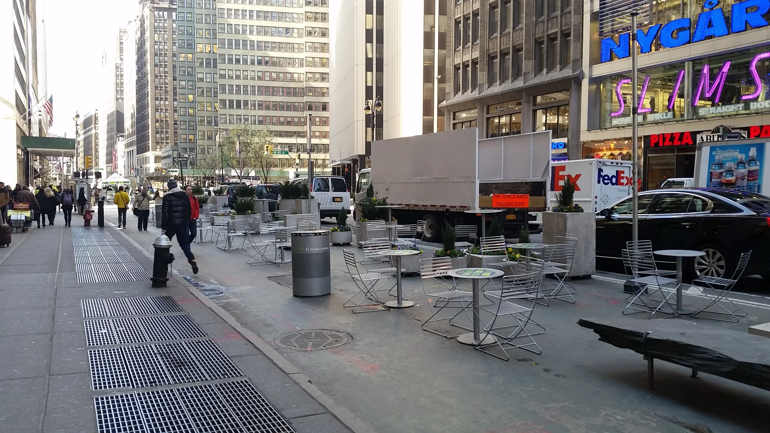 Reclaiming a portion of a street from automobiles in NYC.