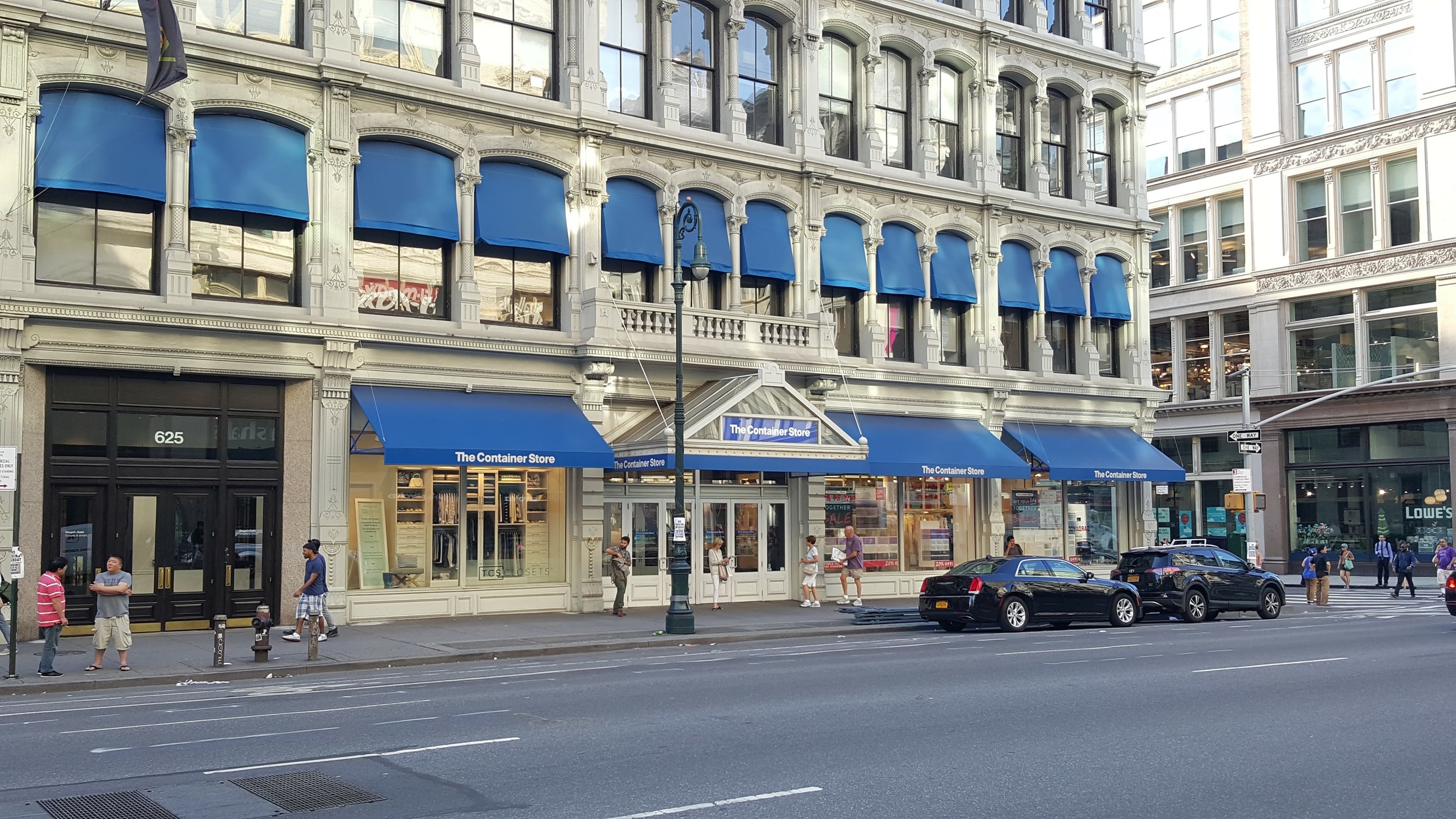 The Container Store along 6th Avenue. Plenty of windows letting you see the activity inside and interesting architecture makes this a pleasant building to walk past.