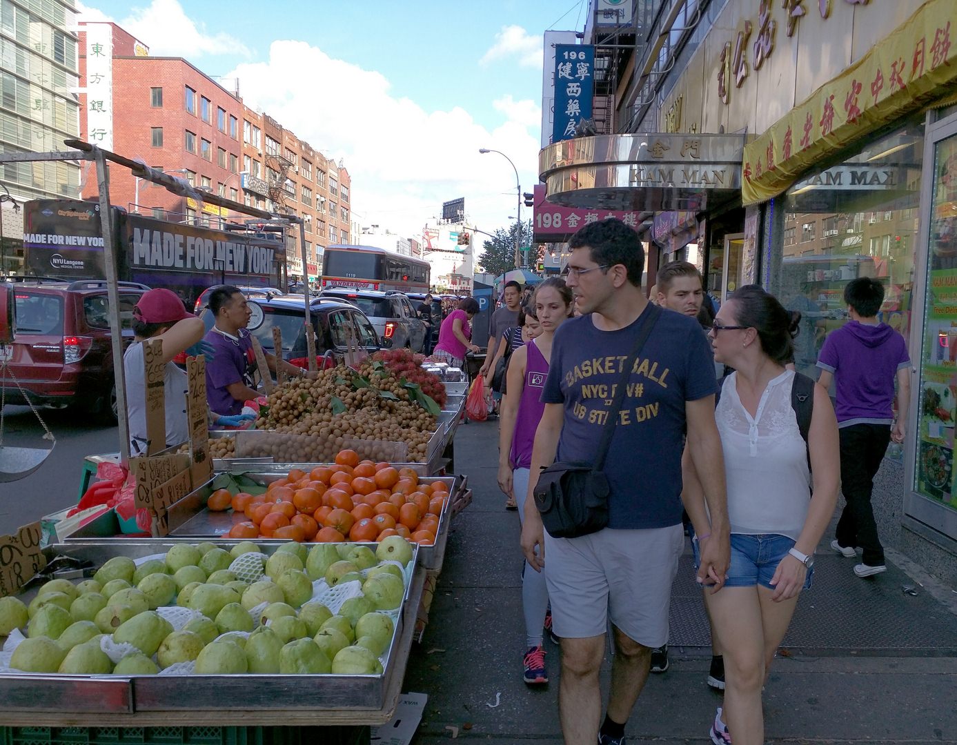 In New York City’s Chinatown foods can be sold from the sidewalk. Note how the pedestrians’ eyes are drawn to the produce. (Photo by Alexander Dukes)