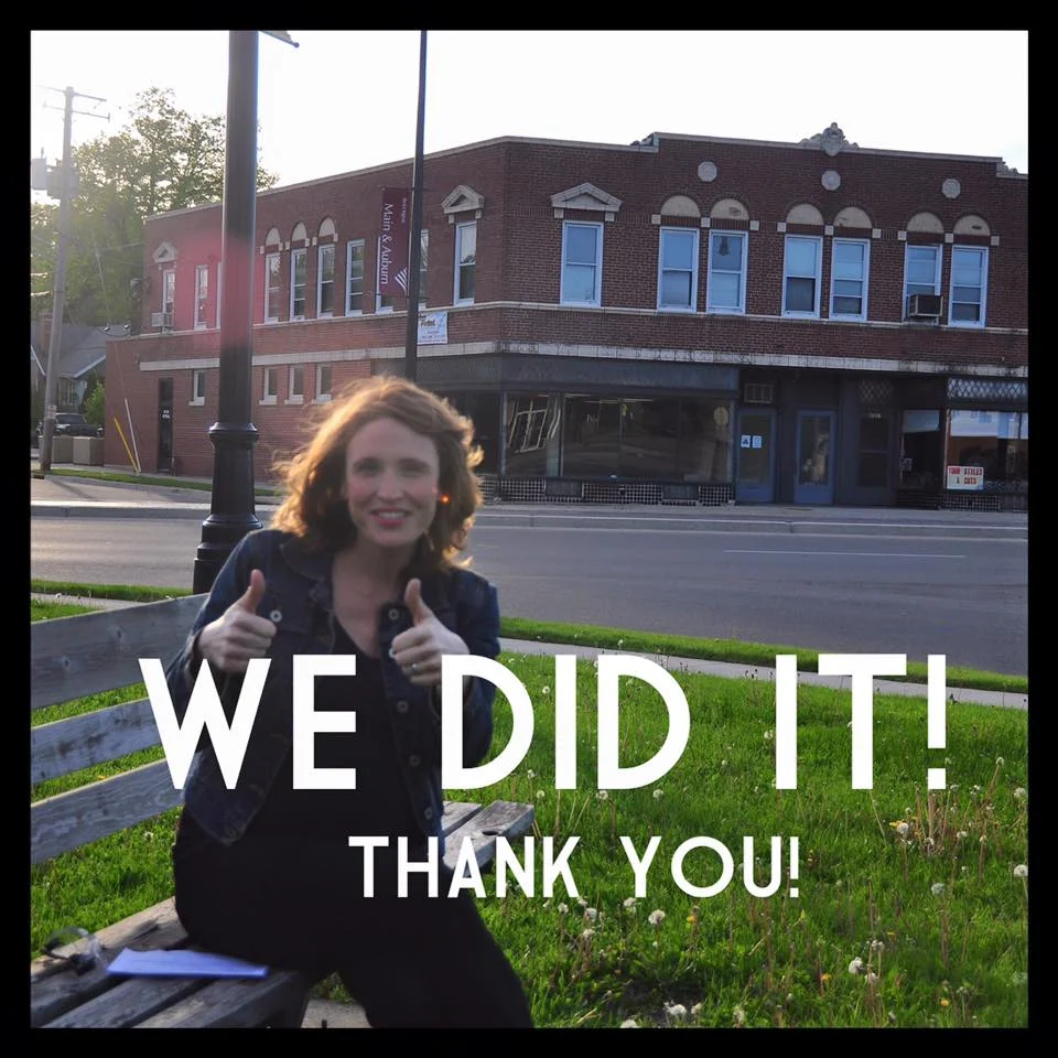 Emily shares the news that her Kickstarter campaign was successful. Behind her is the building. (Image from The Norwegian Facebook page)