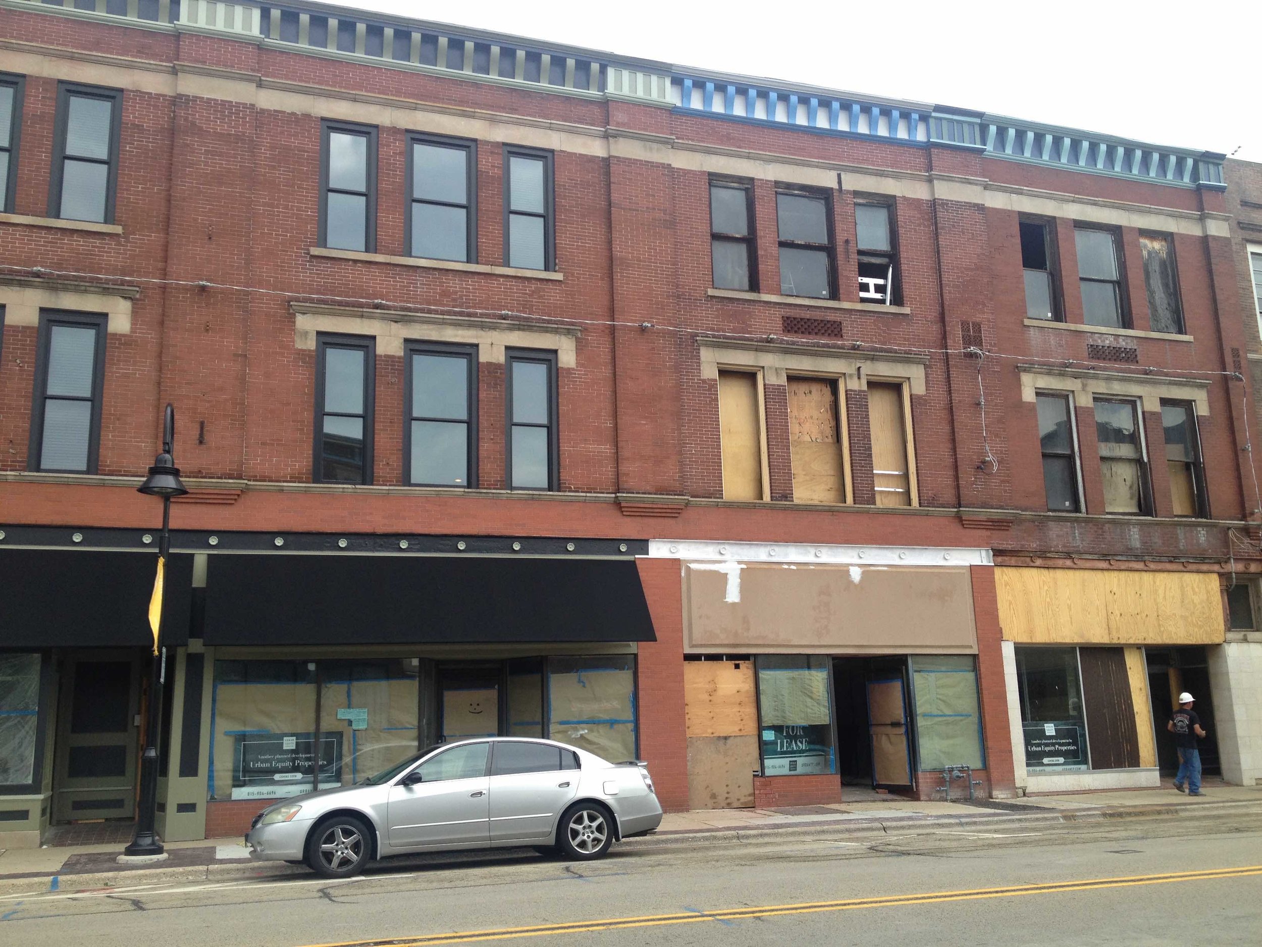 A mixed-use building in Midtown is being renovated and turned into apartments/commercial space. The left side with black awnings is the finished product. The right side with boarded windows is in process. This project is not owned by ZION Development but it's clear that their initiative has encouraged other developers to get to work improving the neighborhood.