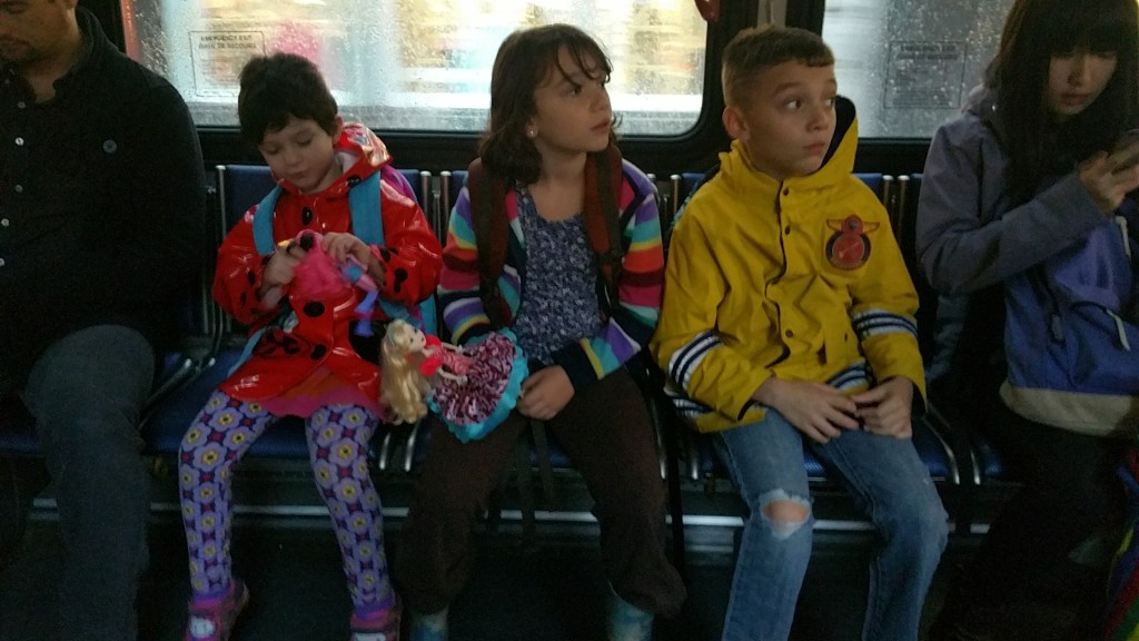 Just another group of commuters, on their way to school on a rainy day.