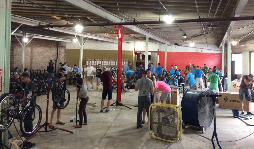 Volunteers assemble bikes for Bike Club - Photo by Sarah Kobos