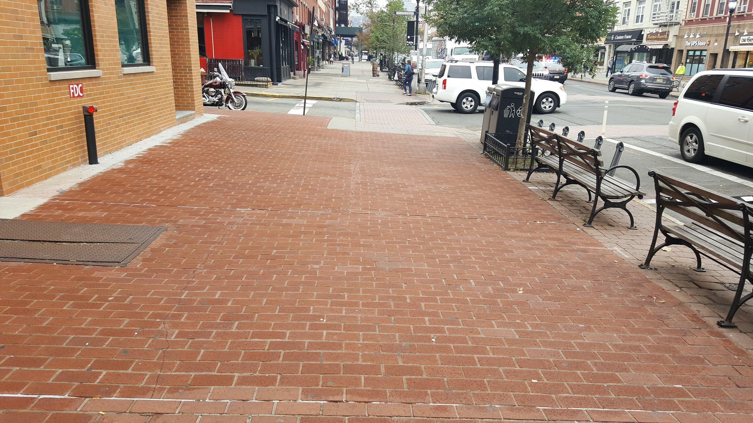 A recently paved brick sidewalk along Washington Street.