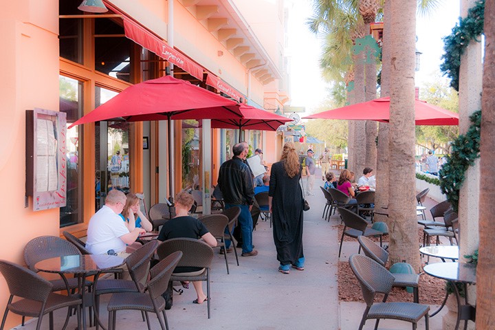 Celebration sidewalk cafe protected by street trees
