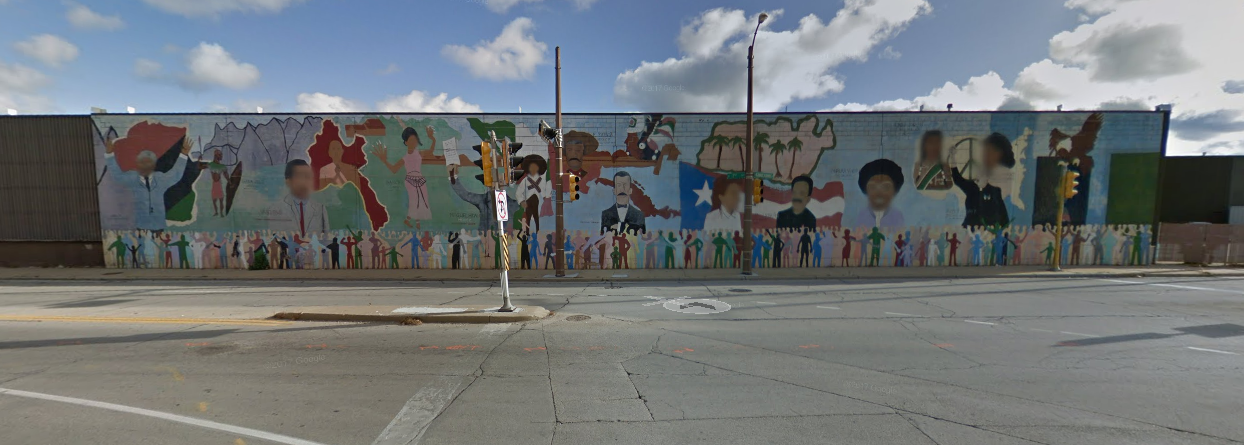 Image from Google Earth (which has hilariously blurred the faces of every person featured in the mural)