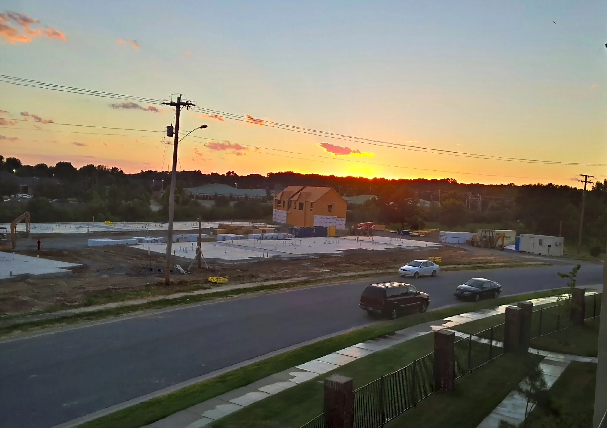 The view outside the window of an apartment complex I used to live in. Note how much greenspace filler there is between the window and the curb. Everything was so spaced out with greenspace and setbacks that there were only a few places within walking distance.