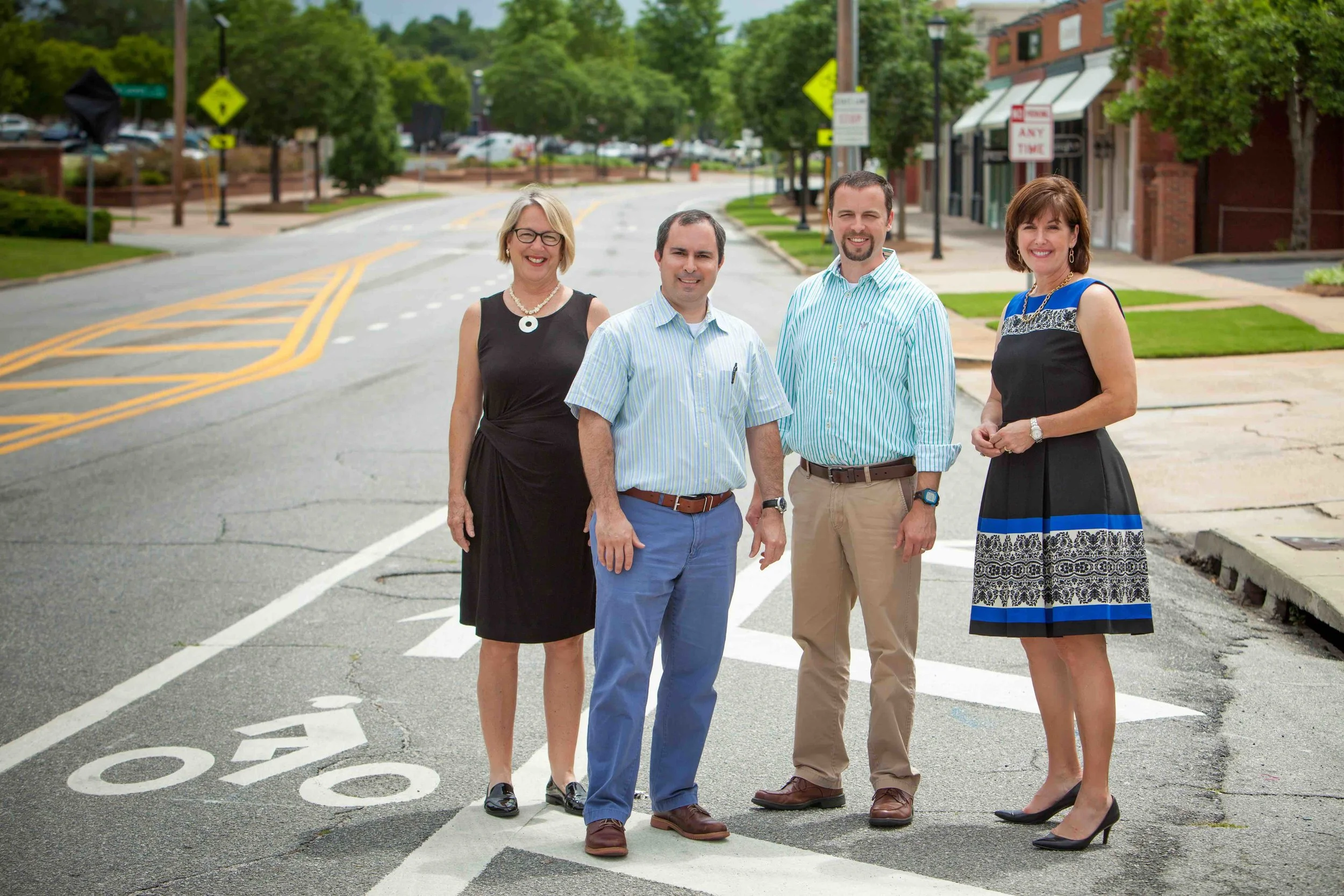 The team that led the 13th street redesign: Anne King (Midtown, Inc.), Will Burgin (Jackson Burgin, Inc)., Tyler Peek – Georgia Department of Transportation, and Betsy Covington (Community Foundation of the Chattahoochee Valley, Inc.). Not pictured: Donna Newman (City of Columbus, Engineering Department Director). Photo by Ritchie White.