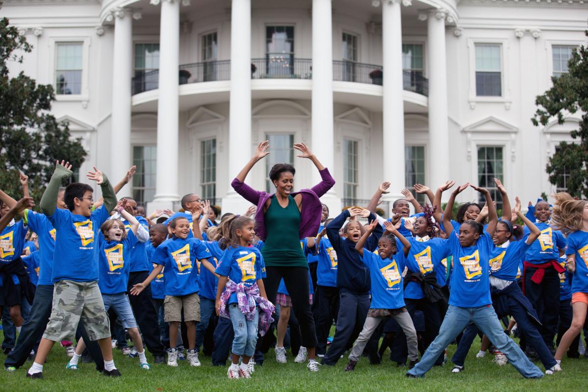 First Lady Michelle Obama exercises with children in front of the White House as part of the Let's Move! campaign. (Official White House Photo by Chuck Kennedy)