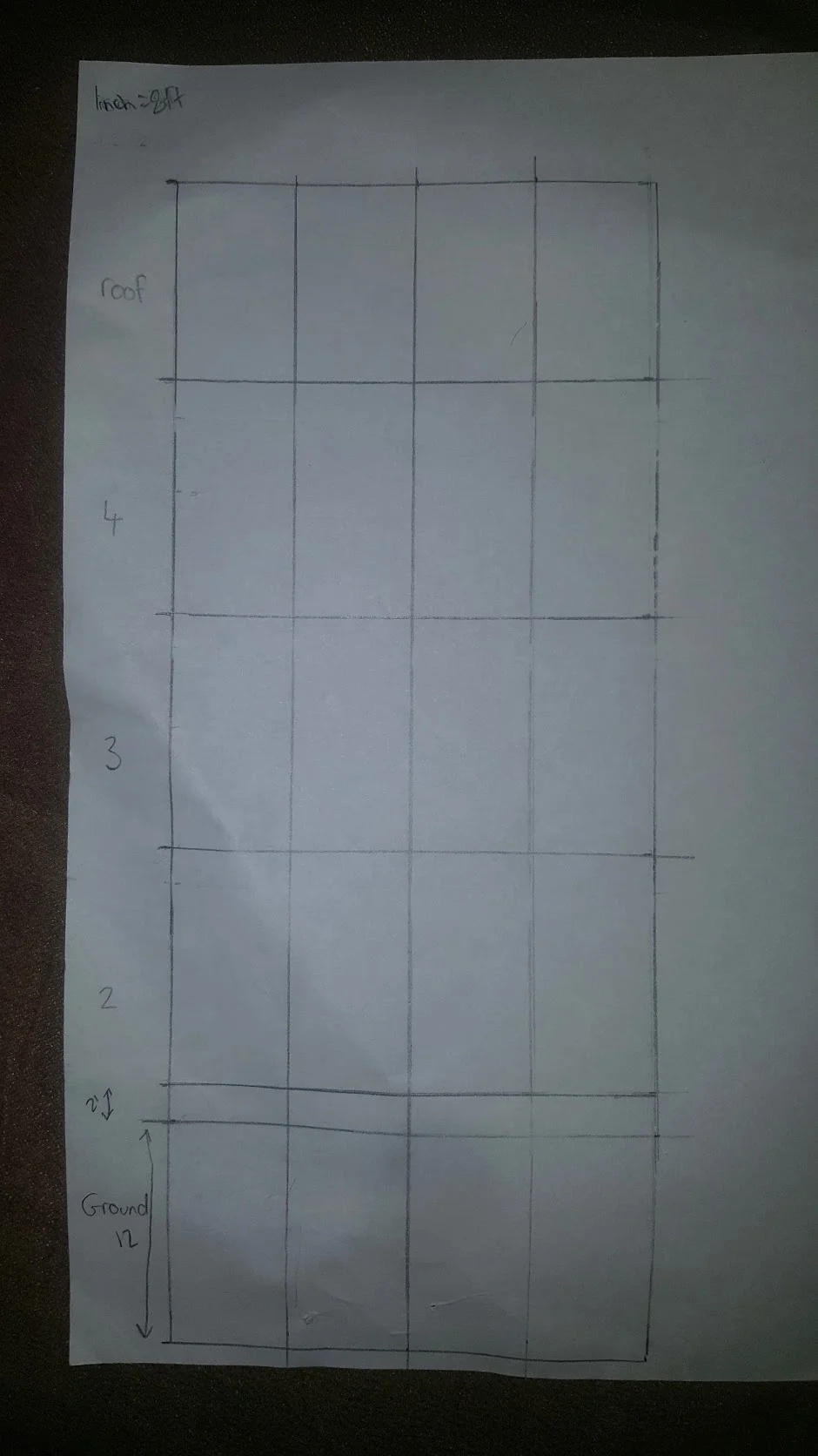 The 25x60 foot front side of my building with guidelines dividing the floors and placement of the doors and windows.