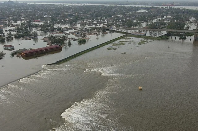 A levee breaks during Hurricane Katrina in New Orleans. (Source: FEMA )