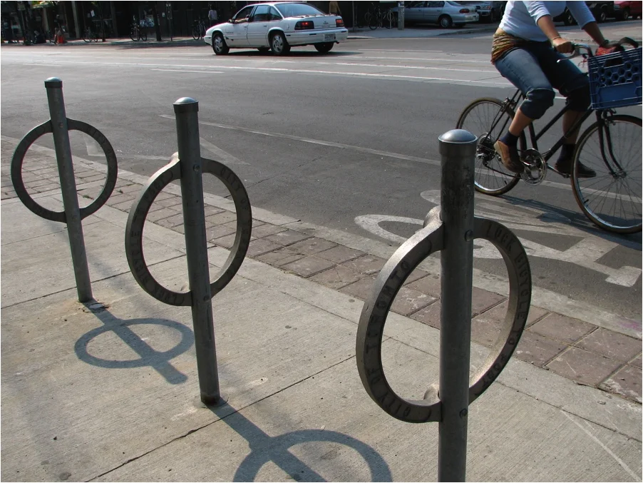 Simple and cheap. Each holds two bicycles. (Source: Wikimedia Commons)