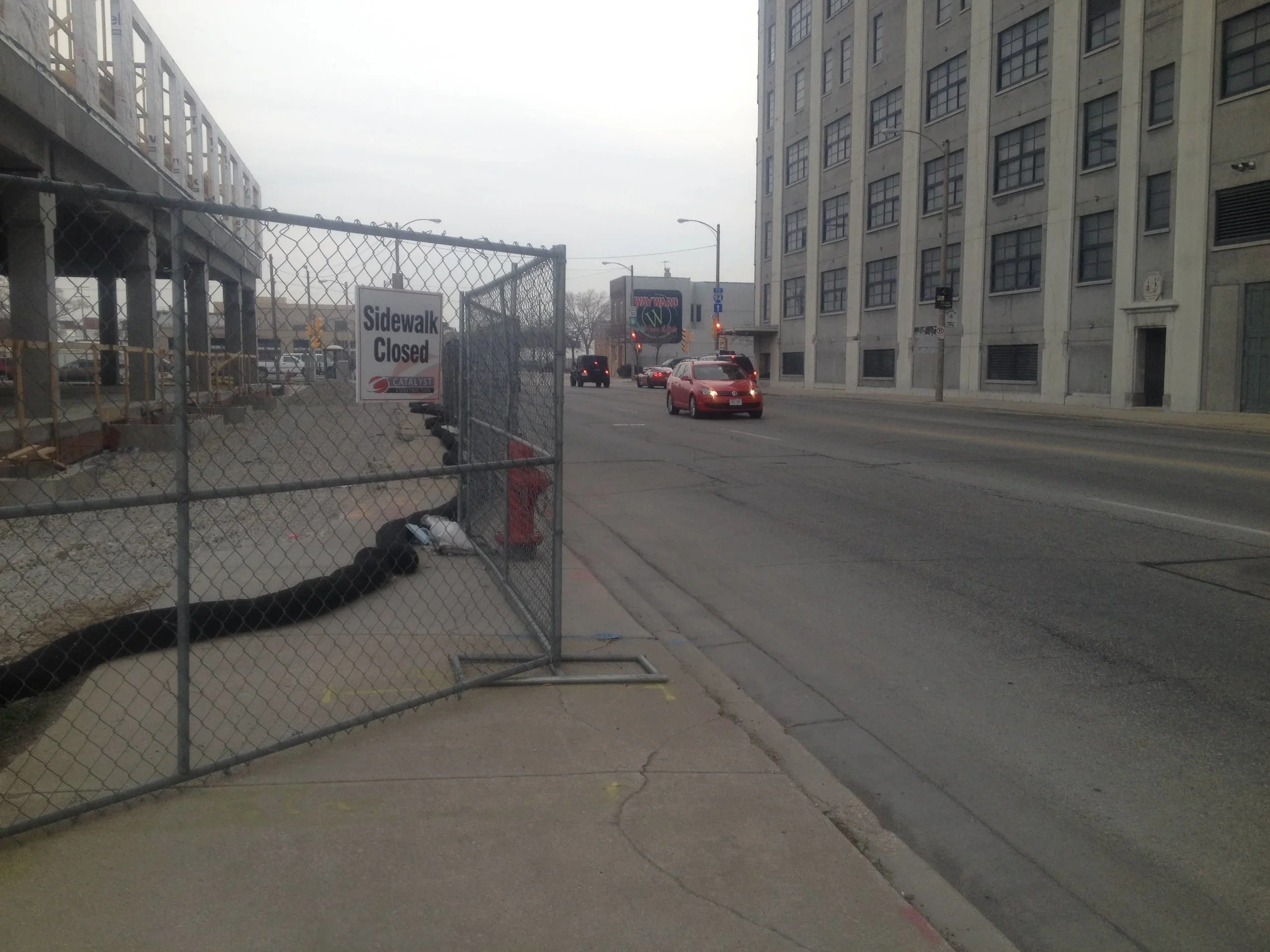 Surprise! The sidewalk's closed. Good luck getting across the middle of this busy street on foot. (Source: Rachel Quednau)