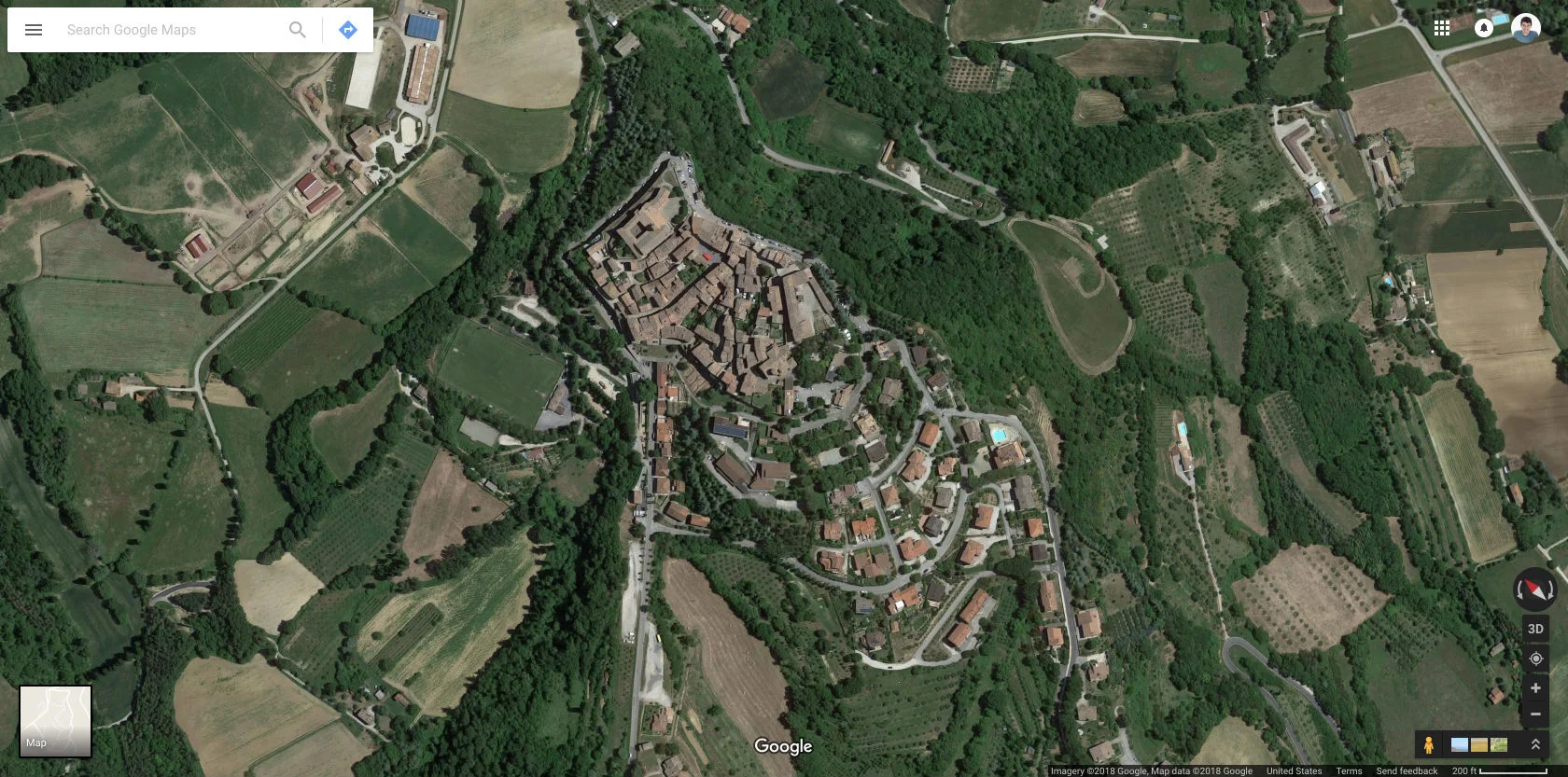 Montone, Umbria, Italy. No fancy transit. They have a bus that comes to the edge of town, otherwise there are parking lots around the outskirts. (Source: Google Maps )