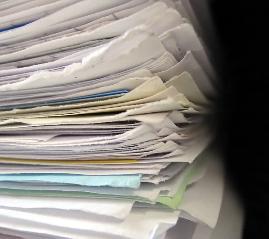 If your city requires a stack of papers this thick just to get approval for a simple addition on a home or business, something is wrong. (Source: Niklas Bildhauer)