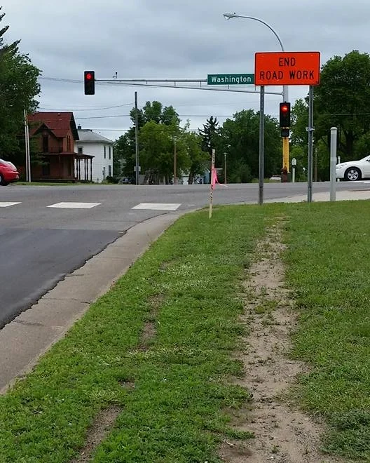 A worn path in the grass suggests desperate need for a sidewalk. What a simple fix.