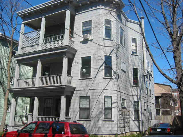 A triple-decker: a type of Missing Middle housing common to Portland and other New England cities. (Source: Wikimedia Commons)