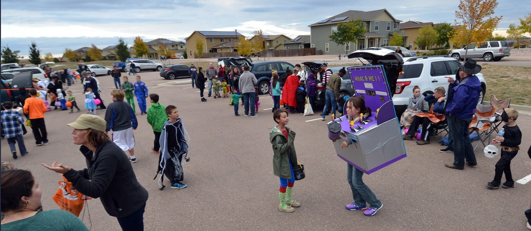 Kids fill a parking lot Trunk-or-Treat event at Schriever Air Force base. Photo credit: Schiever Air Force Base.