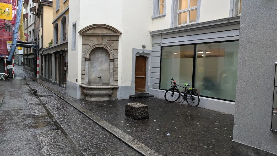 Because the buildings were not perfectly aligned, we find nooks and crannies that are often used for fountains, outdoor dining, or sometimes bicycle or car parking, such as here in Lucerne, Switzerland.