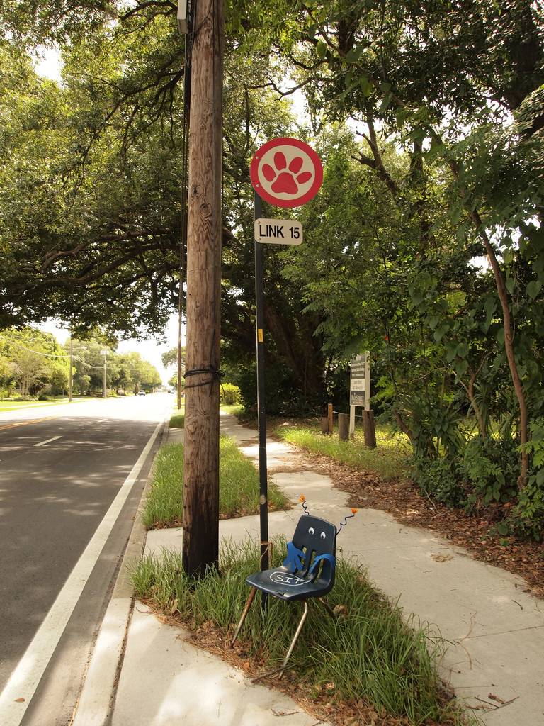 Bus stops like this one in Orlando are useless to many seniors, despite the efforts of an enterprising citizen in this case to redress the lack of seating. (Image via Flickr )