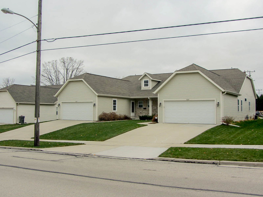 A garage-dominated “snout house.” Arkansas cities cannot ban these anymore, according to the new law. (Image: David Wilson via Flickr )
