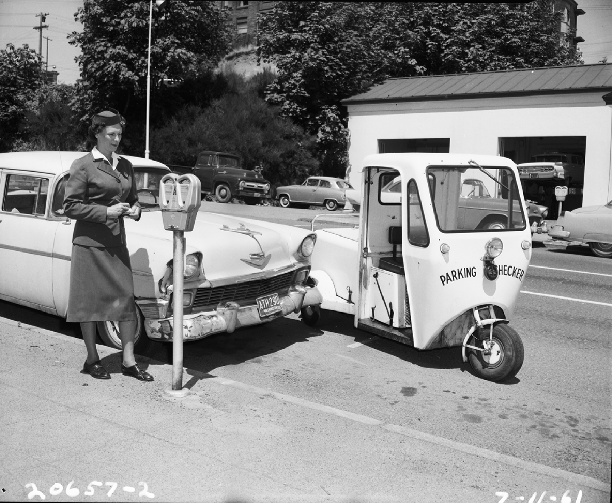 A Parking Checker in Seattle providing a valuble service. (I’m serious.) Image: Seattle Municipal Archives