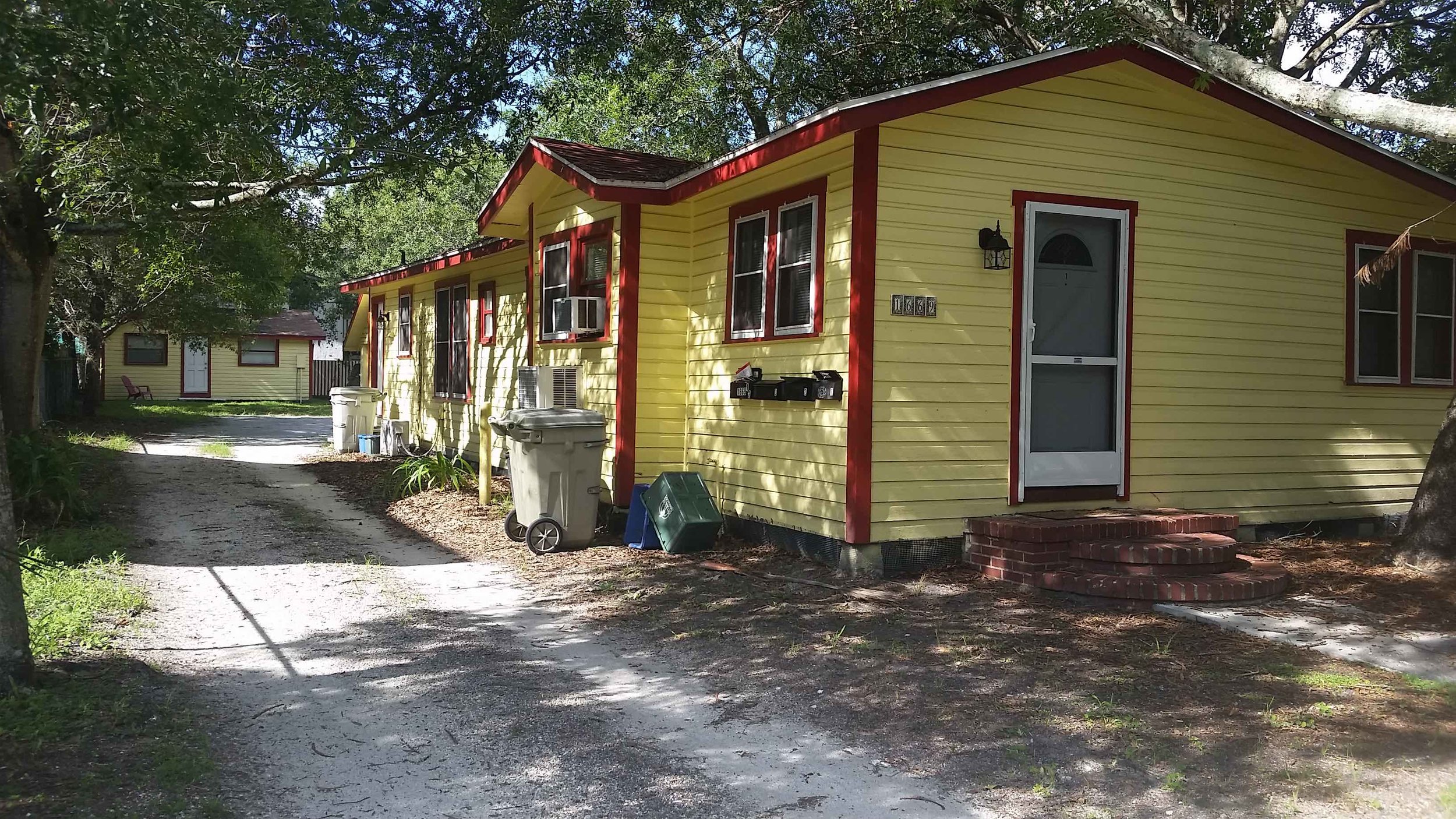 A duplex with a rear ADU: 3 modest homes on a lot that would otherwise hold only one. Now do this again, hundreds of times. (Photo by Daniel Herriges)