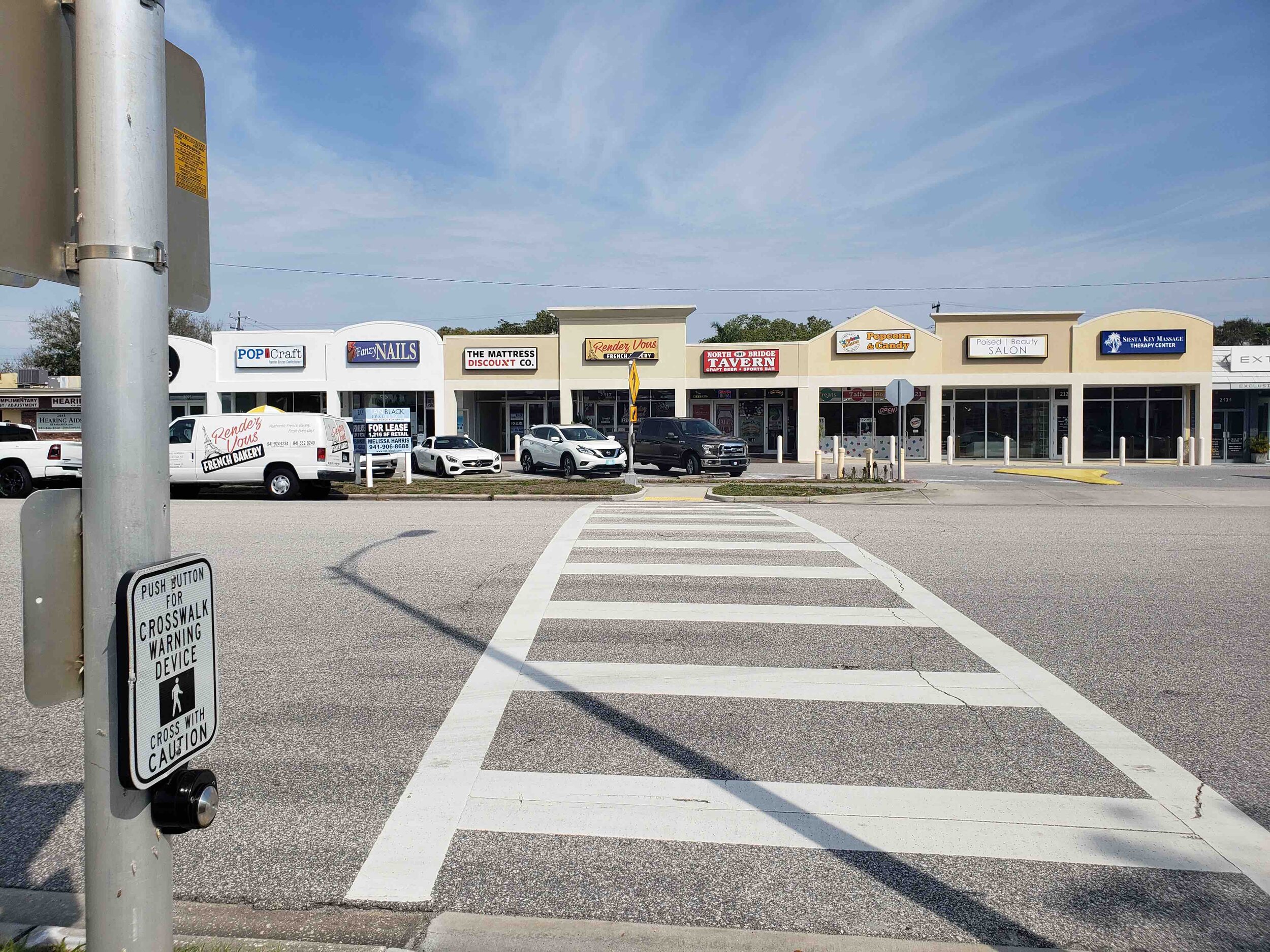  This particular strip mall exists in a very auto-oriented environment, but the city is (slowly) working to make more accommodations for non-drivers. 