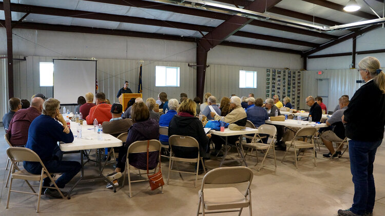 Laura Nowlin (lectern) sharing perspectives on grassroots engagement. Image via Flickr .