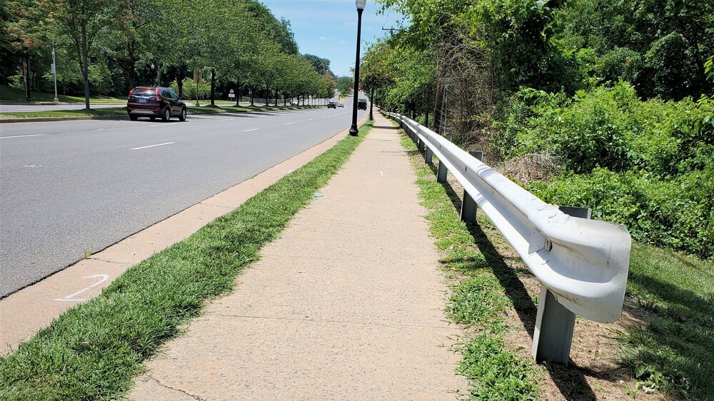 The guardrail’s placement is technically correct, but it symbolizes the protection accorded to motorists and denied to other users of the road.