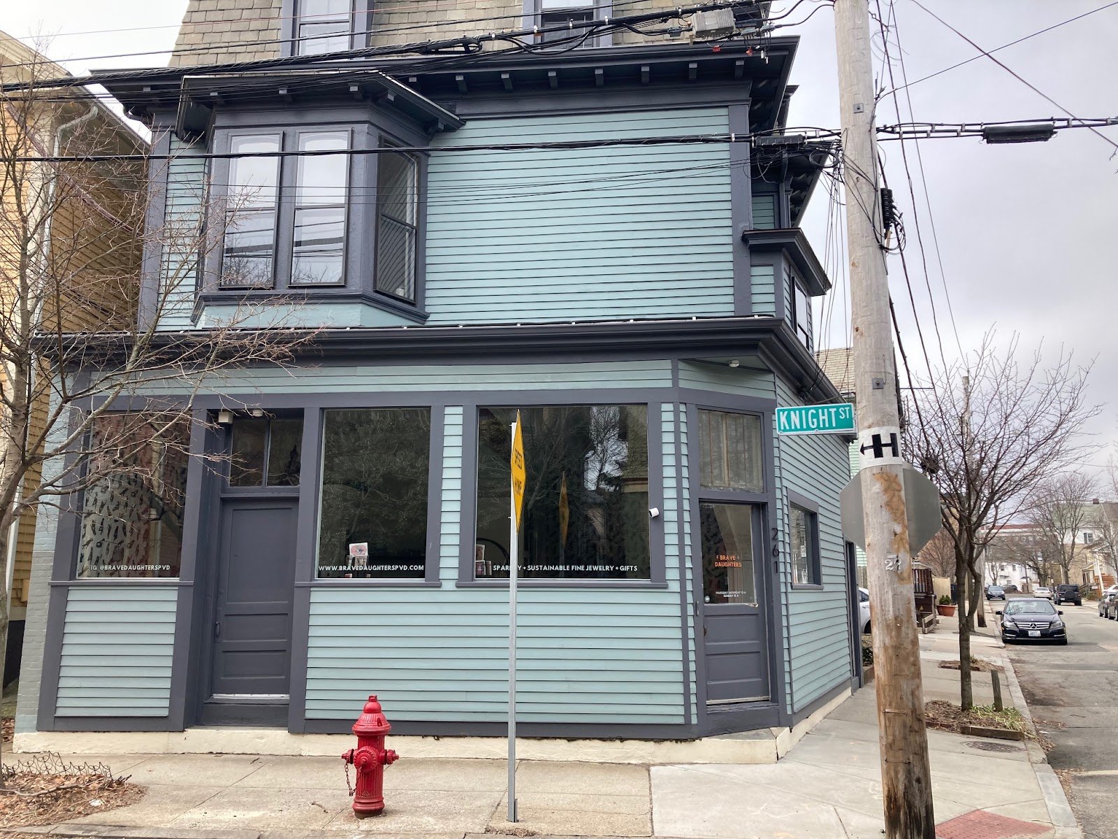  A little artistic jewelry shop on the ground floor of a triple decker. 