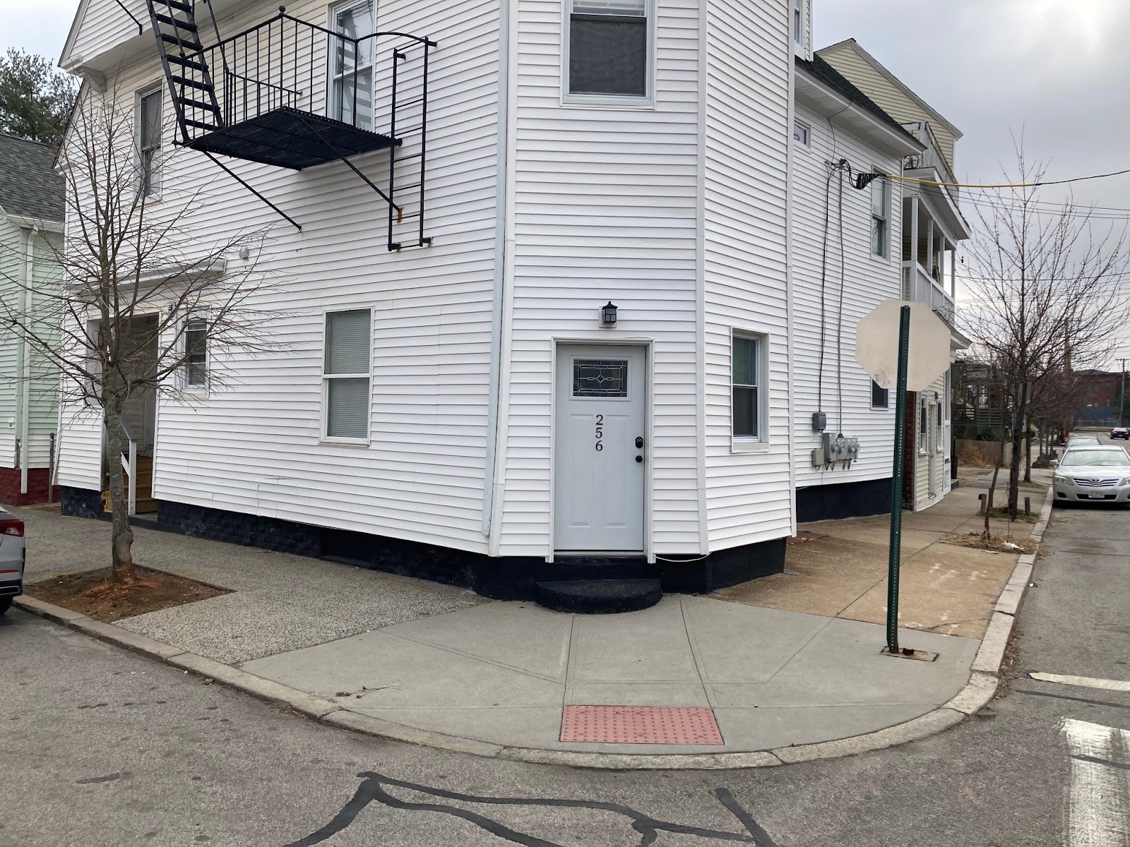  It’s harder to see here under the vinyl, but the storefront entry was here on the corner, with steps up to a direct entry, with the apartments accessed by an entry to the left. 