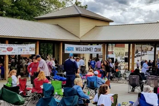community members gather in this photo to learn together and experience life in their community together