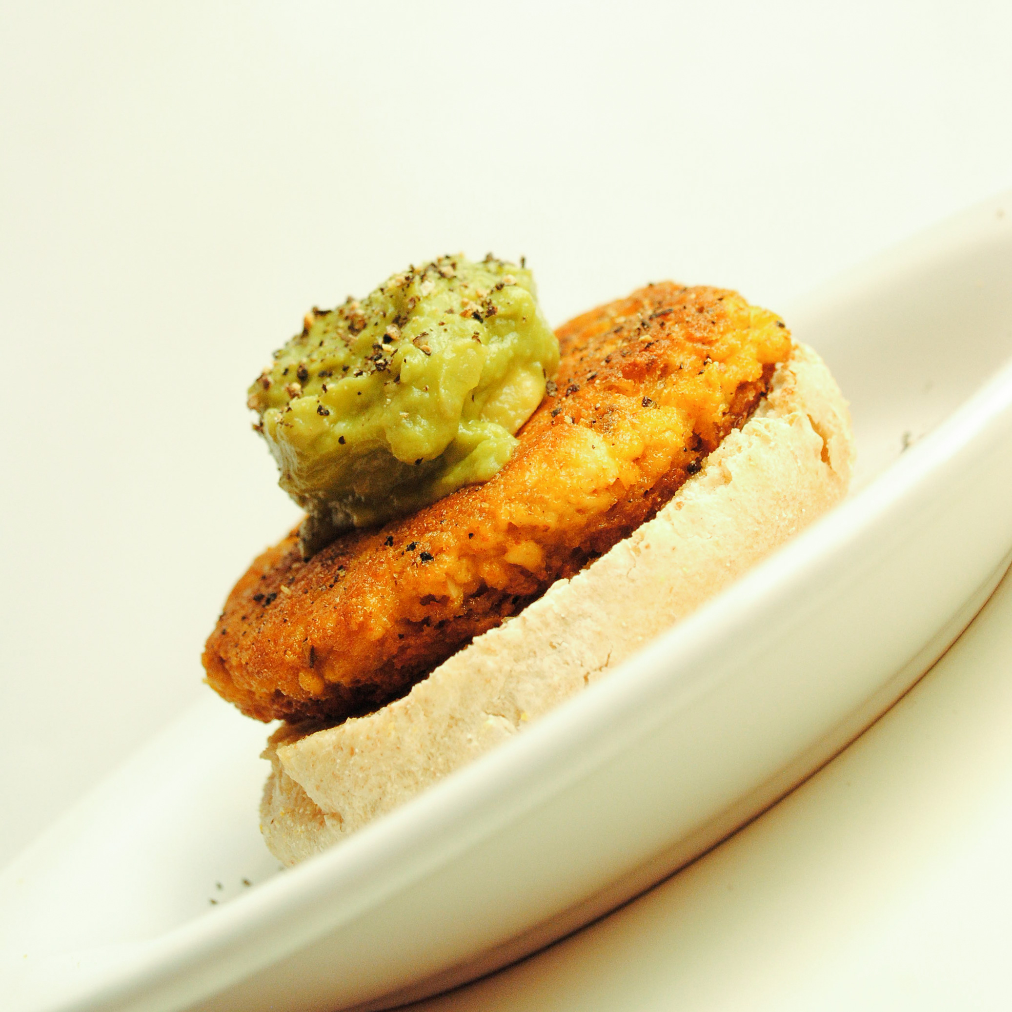 French Onion Tofu Burger on English Muffin w/ Guacamole & Lemon Pepper