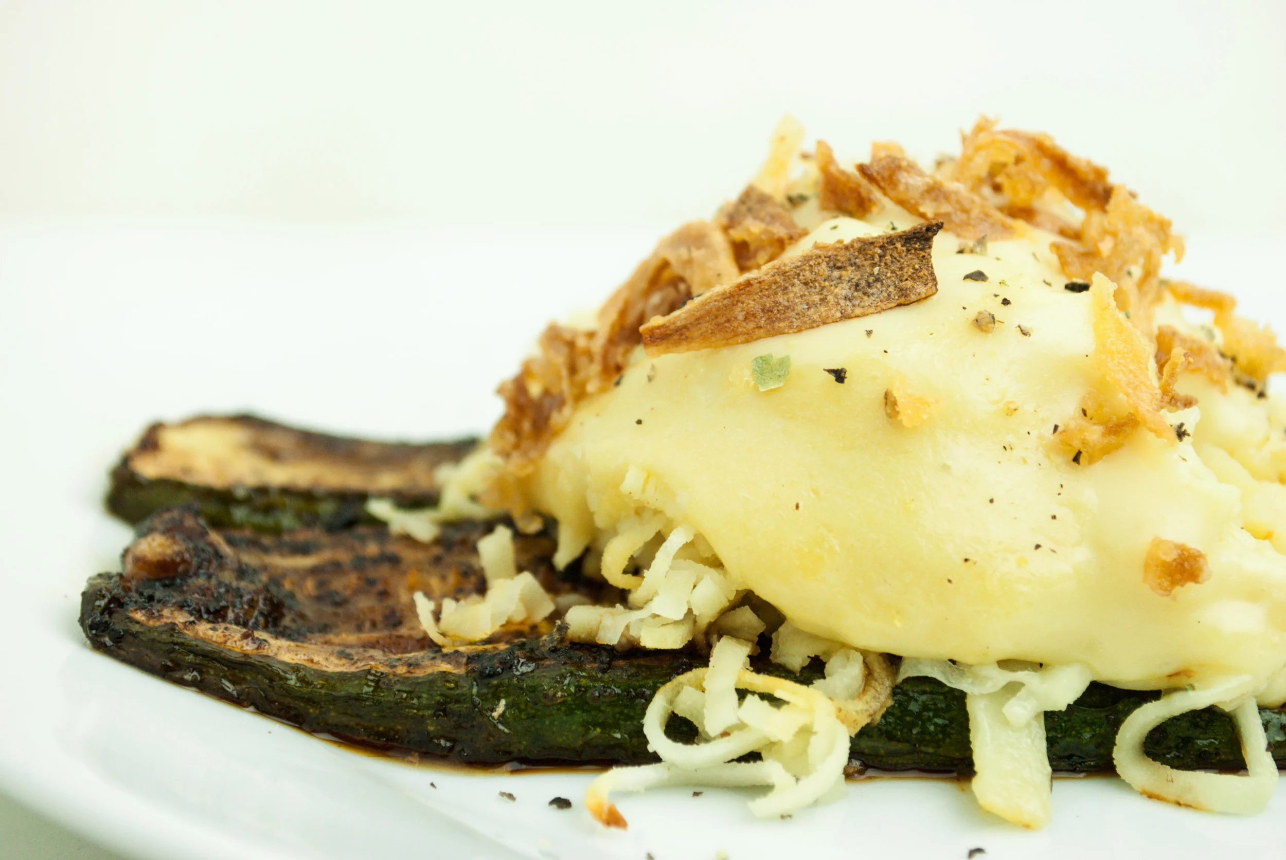 "Cheezy" Parsnip Noodles atop Grilled Zucchini