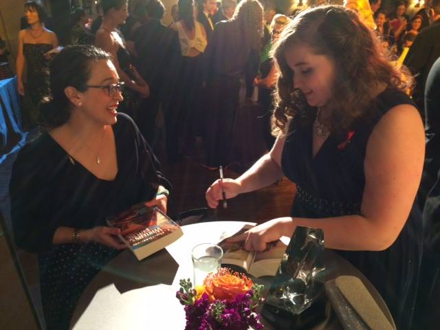 Megan Signing a copy of L. Ron Hubbard Writers of the Future Volume 31
