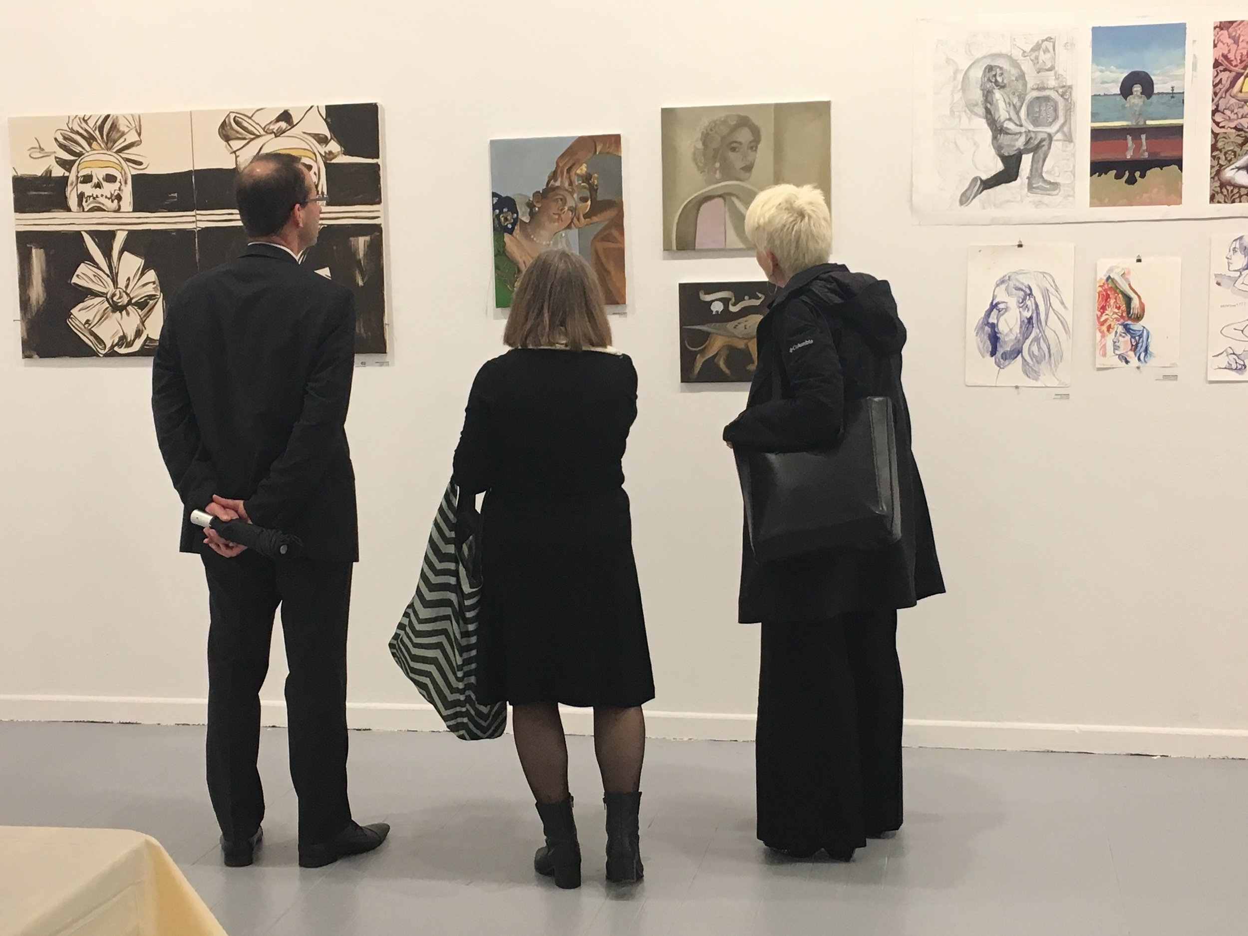 1 - President Frances Bronet and her husband Jeff Paules looking at MFA student Jessica Niello's oil paintings with Pratt in Venice Director Diana Gisolfi.jpg