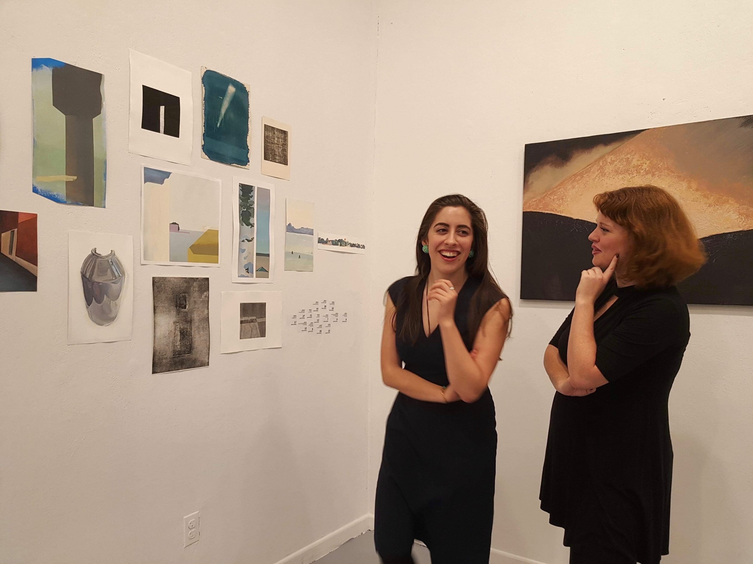 Graduate Assistant Safiye Senturk (MSLIS:MA Art History; PIV 2017) and Marietta Burdick (BA Art History; PIV 2017) admiring Xingze Li's work.jpg