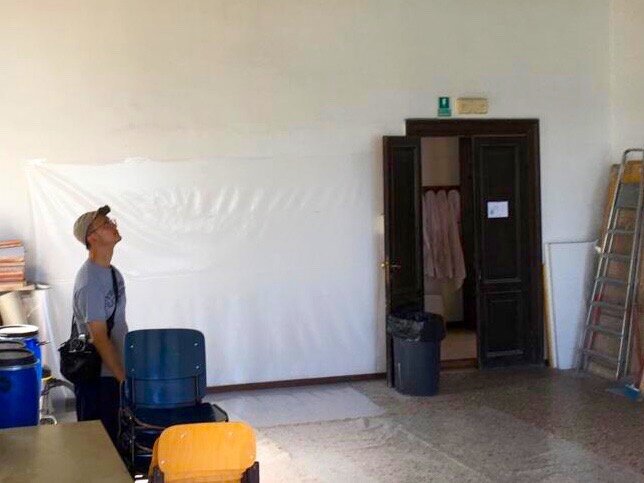 Kosuke in the painting studios at UIA before setting up