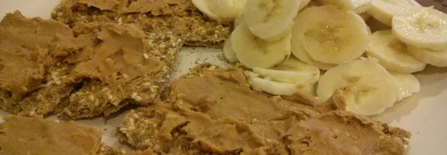 DIY Ryvita with peanut butter and thin slices of banana