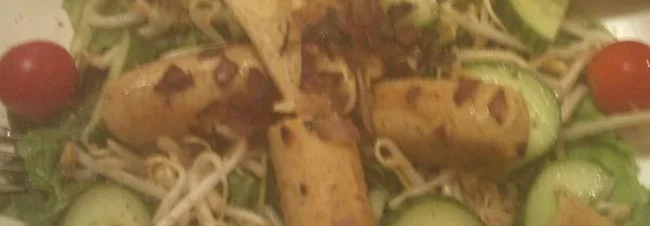 Sausages on a bed of salad