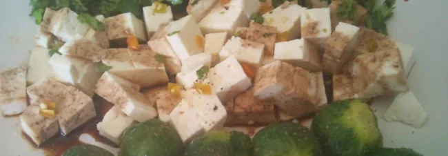 Tofu garnished with soy sauce, corainder and chilli, served with Brussels Sprouts