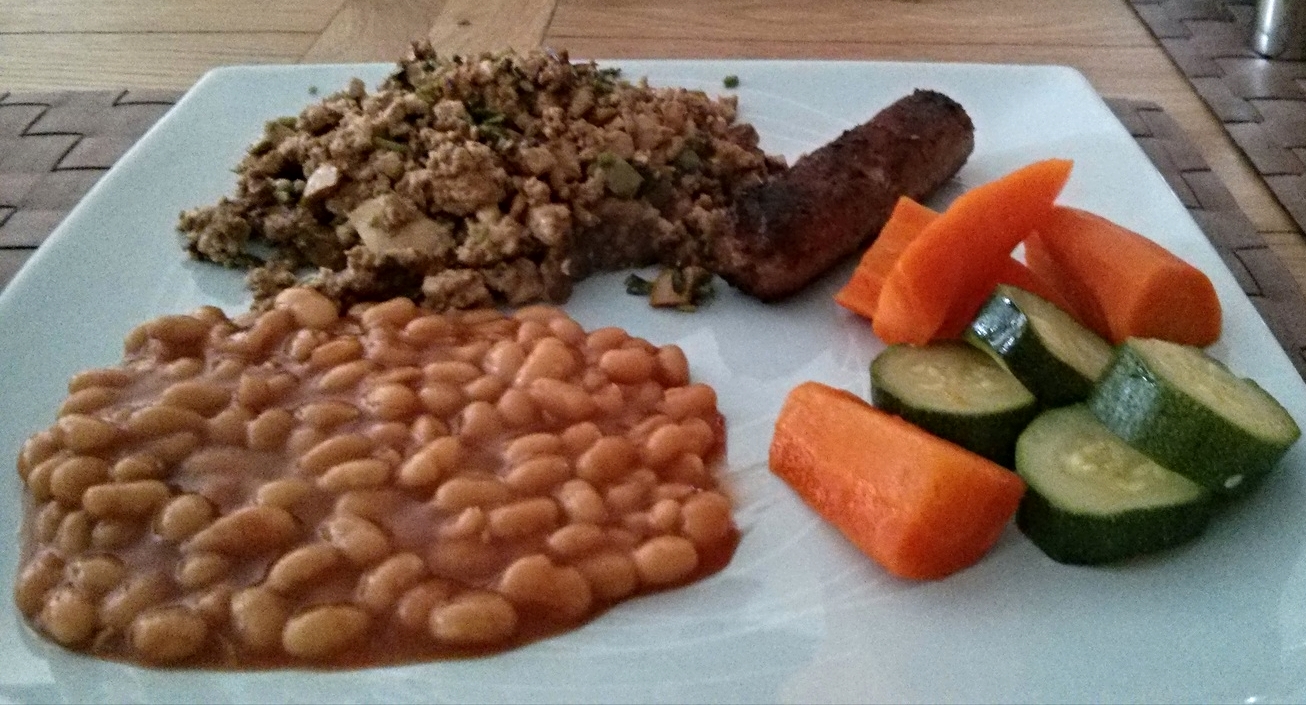 Scrambled tofu with vegetables, beans and sausages