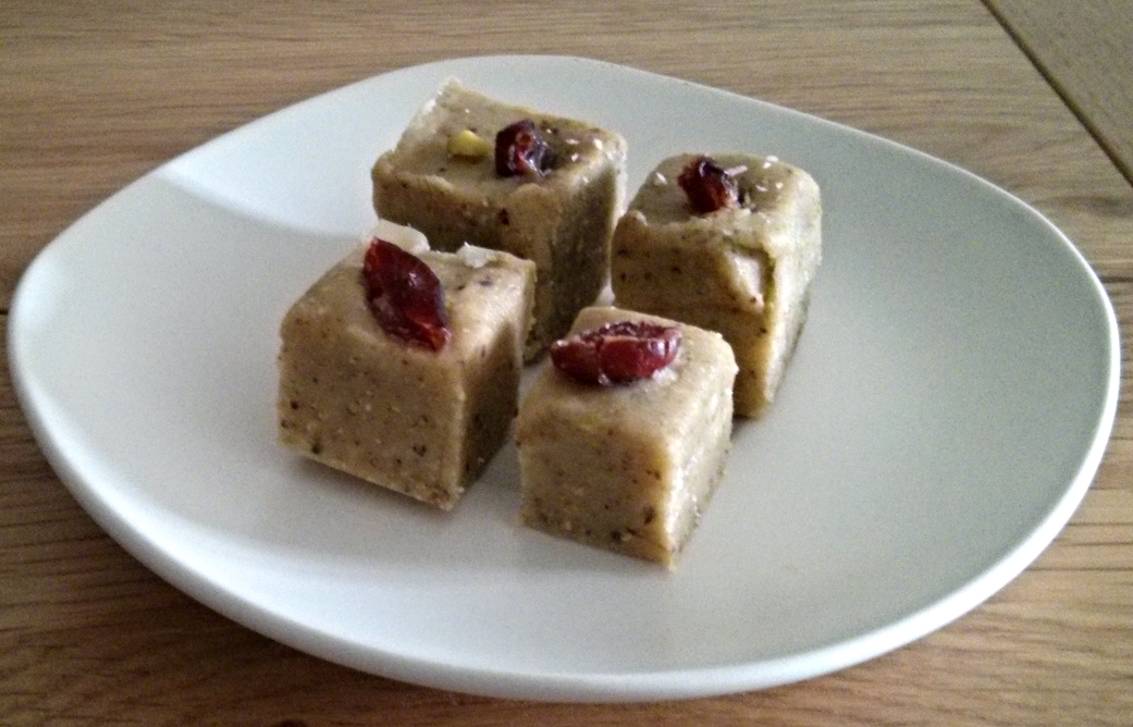 Pista Barfi garnished with dried cranberries